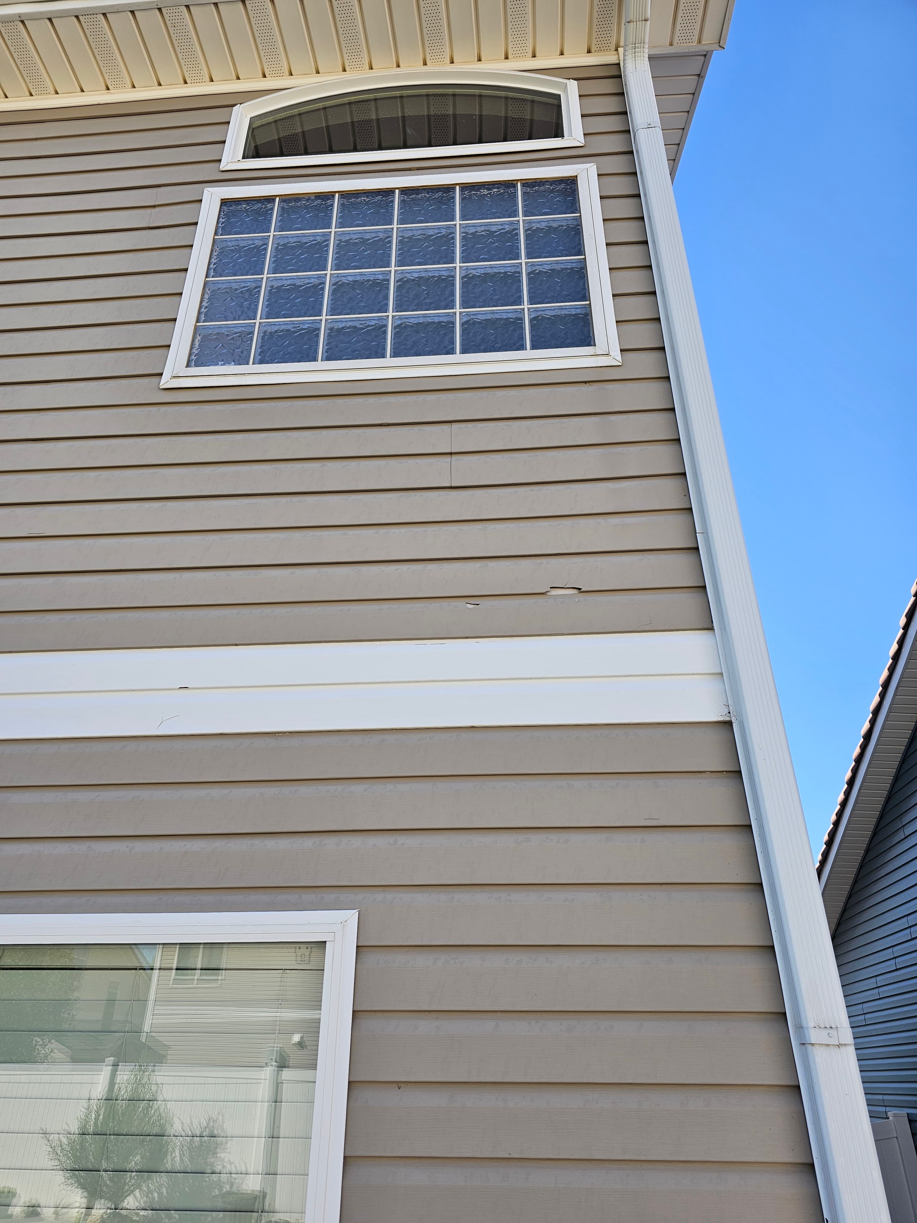 Storm-damaged siding replaced by Hilltop Contracting