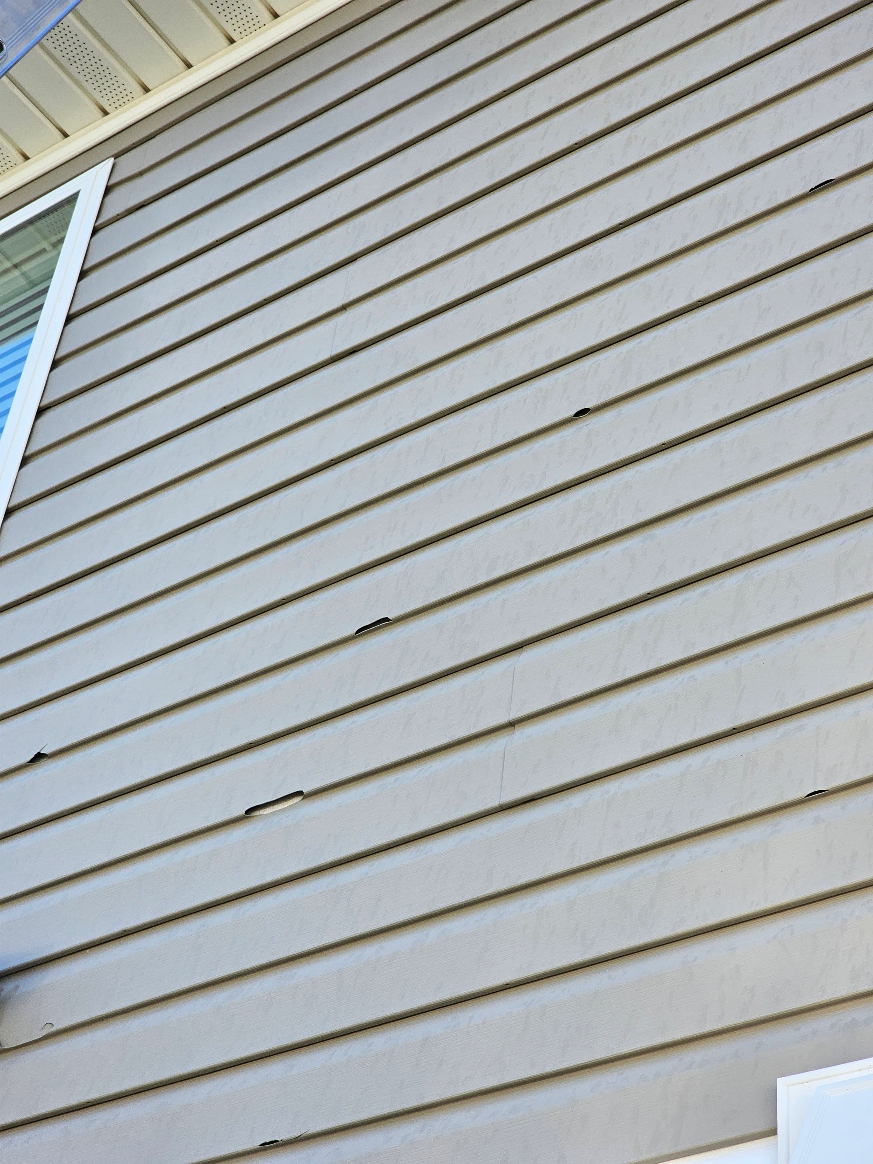 Hilltop siding crew at work in Aurora, CO